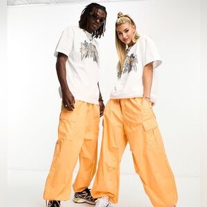Weekday parachute pants in orange, 100% cotton fabric. New with tags.